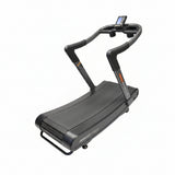 Profile view of an Assault Fitness AirRunner Elite manual curved treadmill with a black textured slatted running surface and sleek steel frame.