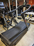 Close-up of the high-contrast LCD console on an Assault Fitness AirRunner Elite displaying built-in workout programs and Bluetooth connectivity icons.
