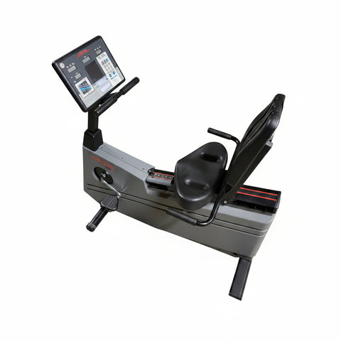 Full-length side profile of a silver and gray Life Fitness Lifecycle 9100 upright commercial exercise bike with an adjustable seat, racing handlebars, and a heavy steel frame base.