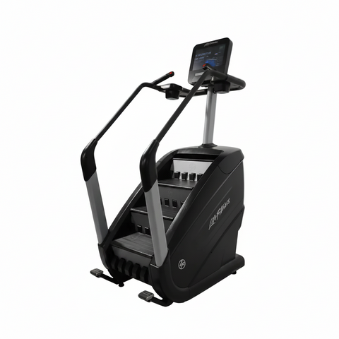  Full profile view of a Life Fitness PowerMill commercial stair climber featuring a dark gray frame, bullhorn handlebars, tiered moving steps, and a large tablet-style console screen.