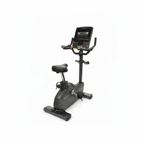 Matrix Endurance commercial upright stationary cycle bike with an ergonomic seat, multi-position handlebars, and a step-through frame design