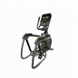  Front-angle view of a Matrix Performance Lower Body Ascent Trainer fitness machine showcasing its track-free suspension design, stationary handlebars, and oversized foot pedals on a dark commercial gym floor.