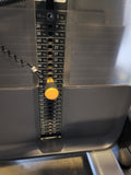  Close-up of the 240 lb selectorized weight stack on a Precor DSL0310 seated row with a yellow magnetic selector pin.