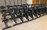 Detailed view of the fore-aft and vertical adjustment levers for the handlebars and saddle on a Precor SBK 661 studio cycle