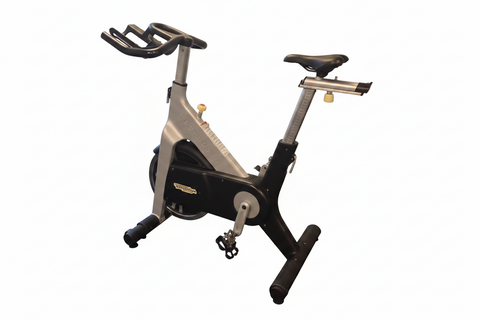  A sturdy Technogym Group Cycle D92 off-lease commercial spin bike with a front-drive flywheel and sleek Italian frame design.
